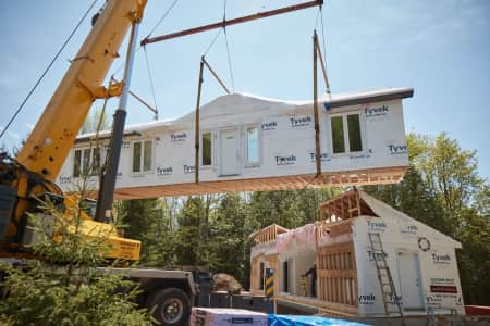 Modular construction being loaded with crane